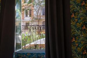 a window with a view of a building at Roma story in Rome