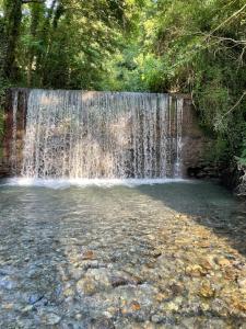 a waterfall in the middle of a pool of water at Residenza Matilde in Fiumefreddo Bruzio