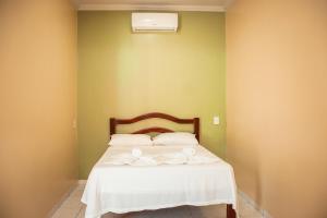 Ένα ή περισσότερα κρεβάτια σε δωμάτιο στο Pousada João de Barro