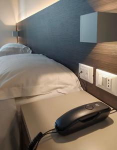 Postel nebo postele na pokoji v ubytování Hotel Friuli
