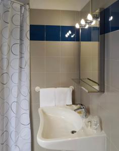 Koupelna v ubytování Hotel Friuli + 23 fotografií