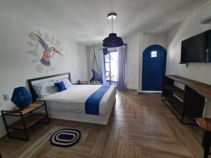 Een bed of bedden in een kamer bij CASA NDOMI TEPOZ