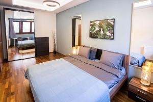 Posteľ alebo postele v izbe v ubytovaní Urban Jungle Apartment in the Citycenter
