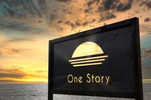 a one story sign with the sunset in the background at Nihonkai Yuhi Villa One Story - Vacation STAY 67117v 