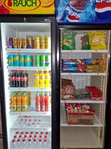 an open refrigerator filled with drinks and food at Hotel Yal Restaurant in Tetovo