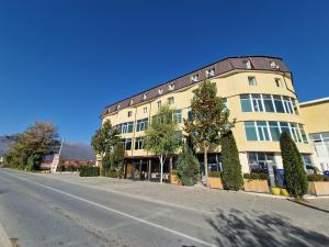 a large building on the side of a street at Hotel Yal Restaurant in Tetovo