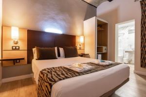 Posteľ alebo postele v izbe v ubytovaní Hotel Copacabana Tarifa Beach + 37 fotografií