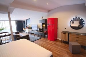 a living room with a red refrigerator and a desk at Home of Galataport in Istanbul