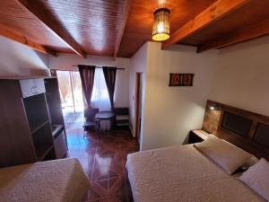Postel nebo postele na pokoji v ubytování Lalck Cketi Hotelería y Turismo