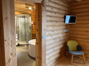 a bathroom with a tub and a television on a wall at Saint Bernard in Font Romeu Odeillo Via +19 photos