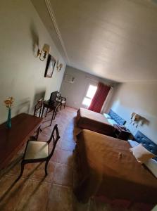Una cama o camas en una habitación de Hotel Pórtico Norte