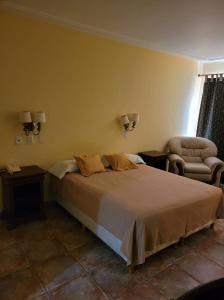 Una cama o camas en una habitación de Hotel Pórtico Norte