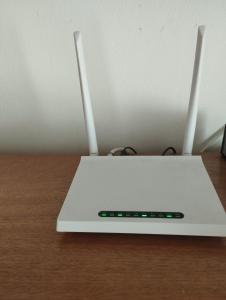 a white laptop computer sitting on top of a table at Casa Langla Lunahuana in Lunahuaná