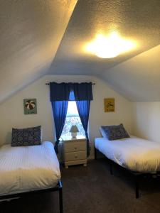 Ένα ή περισσότερα κρεβάτια σε δωμάτιο στο Guesthouse Cannon Beach