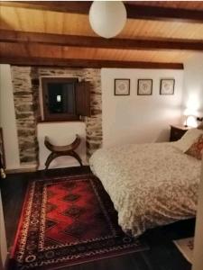 Katil atau katil-katil dalam bilik di Casa de piedra en pequeña aldea de Ortigueira