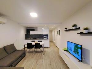 TV a/nebo společenská místnost v ubytování Molinos holidays playa del inglés