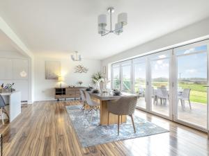 a kitchen and dining room with a table and chairs at Hill Crest in Dunston