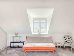 a white room with a bed and a window at Hill Crest in Dunston