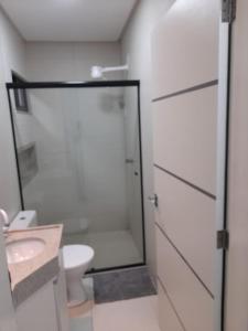 a bathroom with a shower and a toilet and a sink at FLATS TAVARES ARAUJO 202 in Garanhuns +11 photos