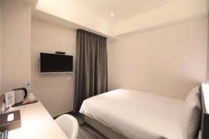 TV a/nebo společenská místnost v ubytování Chair Man Hotel