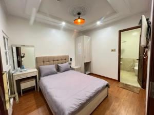 Postel nebo postele na pokoji v ubytování Thanh Anh Hotel Da Lat