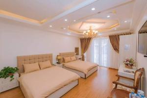 Ένα ή περισσότερα κρεβάτια σε δωμάτιο στο Thanh Anh Hotel Da Lat