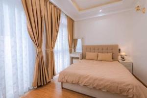 Ένα ή περισσότερα κρεβάτια σε δωμάτιο στο Thanh Anh Hotel Da Lat
