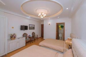 Ένα ή περισσότερα κρεβάτια σε δωμάτιο στο Thanh Anh Hotel Da Lat