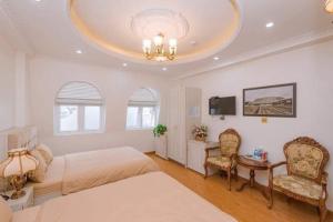 Ένα ή περισσότερα κρεβάτια σε δωμάτιο στο Thanh Anh Hotel Da Lat