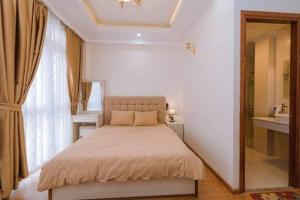 Ένα ή περισσότερα κρεβάτια σε δωμάτιο στο Thanh Anh Hotel Da Lat