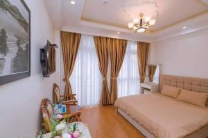 Ένα ή περισσότερα κρεβάτια σε δωμάτιο στο Thanh Anh Hotel Da Lat