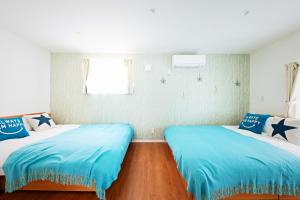 Postel nebo postele na pokoji v ubytování APHONGO HOTEL