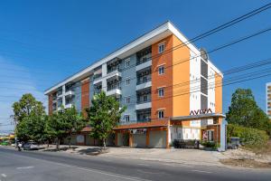 an apartment building on the side of a street at AVIVA RESIDENCES in Thuan An
