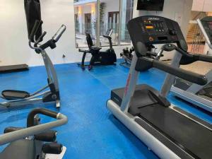 a gym with treadmills and a treadmill at 212 Cartagena Walled City Magical Apt in Cartagena de Indias