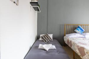 Postel nebo postele na pokoji v ubytování Mac Inn 94