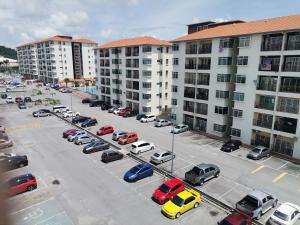a parking lot full of cars in a parking lot at Yuslina Homestay in Bandar Puncak Alam
