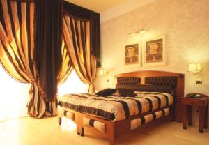 Postel nebo postele na pokoji v ubytování Hotel Columbia Wellness & Spa