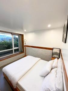 Postel nebo postele na pokoji v ubytování Dalat Topview Homestay