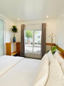 Postel nebo postele na pokoji v ubytování Dalat Topview Homestay