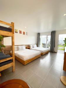 Postel nebo postele na pokoji v ubytování Dalat Topview Homestay