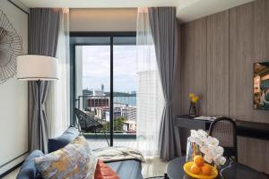 a hotel room with a view of a city at Somerset Pattaya - SHA Plus in Pattaya Central