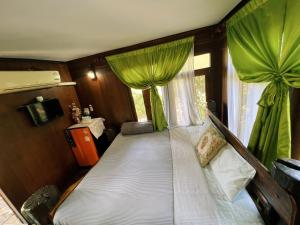 Postel nebo postele na pokoji v ubytování Sukhothai City Resort