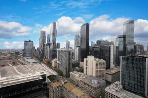 a view of a large city with tall buildings at Orange Stay at Melbourne Quarter in Melbourne
