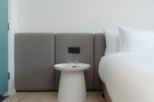 GO! Hotel Bowin at Robinson Lifestyle Bowin客房内的一张或多张床位