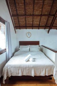 Giường trong phòng chung tại BayayTagoSiargao +16 ảnh