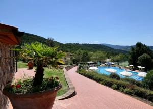 a view of a resort with a swimming pool at Resort Le Tegole in Riparbella
