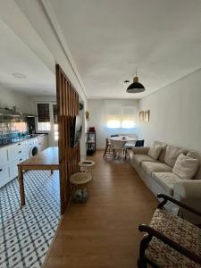 een woonkamer met een bank en een tafel bij Apartment for 4 in Lejona Casa Natalia NO ELEVATOR in Leioa