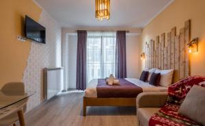 TV a/nebo společenská místnost v ubytování New Gudauri Loft 2 Apartments