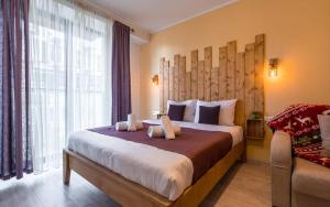 Postel nebo postele na pokoji v ubytování New Gudauri Loft 2 Apartments