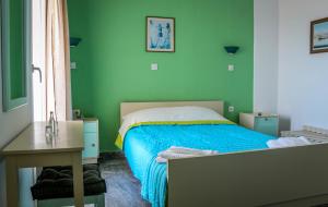 Ένα ή περισσότερα κρεβάτια σε δωμάτιο στο Mirtos Hotel